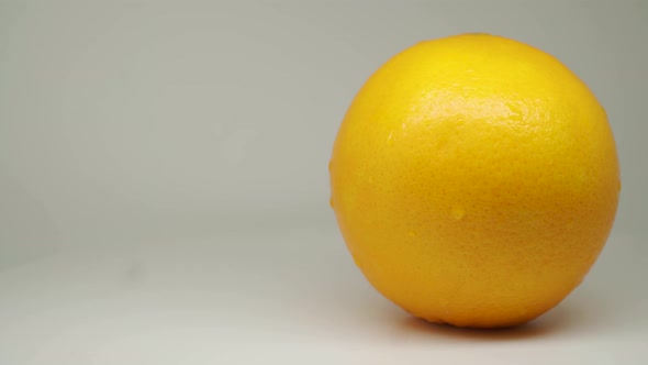 A Pulpy Orange Freshly Picked From The Farm - Close Up Shot