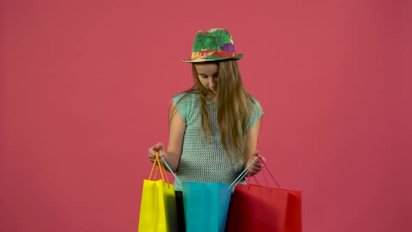 Girl Gets a Red Shoe From the Bag and She Is Happy That the Shopaholic Loves Shopping