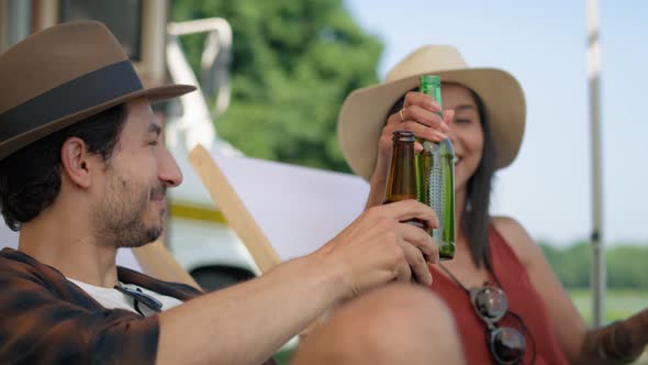 Young friends spending time on the camper side. Shot with RED helium camera in 8K