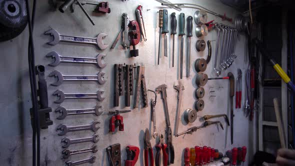 Work Tools Hanging On Wall At Workshop