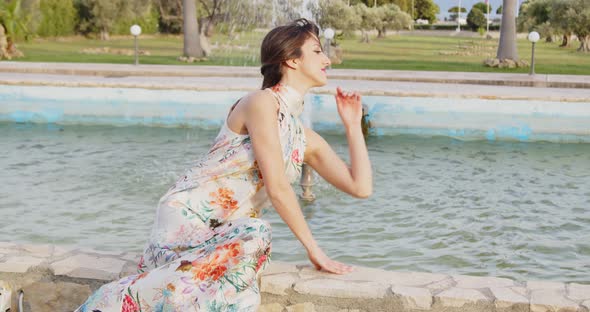 Model with long white dress with flowers