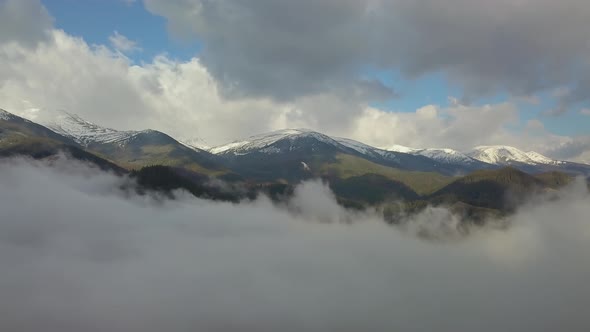 Flying Above the Clouds in the Mountains