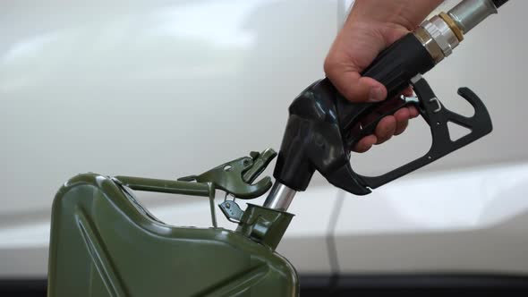 Filling Up a Jerrycan Fuel Container at a Petrol Station 23