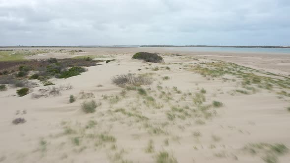 Aerial footage of sand dunes near the mouth of the River Murray in regional Australia