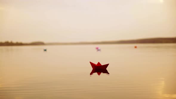 Paper Boats Floating in the River