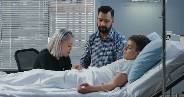 Teenager Boy Lying in Hospital