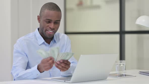 Thumbs Up By Happy African Man Showing Dollars