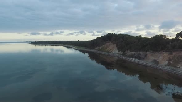 Aerial view of a beach with quiet water