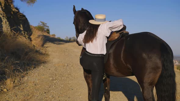 Young Slim Woman Mounting Horse and Purebred Animal Galloping with Rider Away in Slow Motion