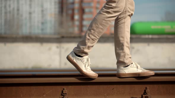 Lonely Businessman Feet In Pants Walking On Rail Road When Train Or Tram Cancelled. Railroad.