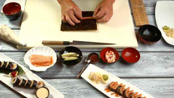 Male Hands Preparing Sushi