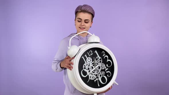 Young Woman with Trendy Look Holding Big Clock Promotion Advertisement