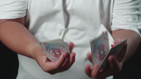 Magician Starts Showing His Trick With Cards, Cardistry On Black Background