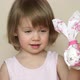 Little Girl Holds Chicken Egg Decorated for Easter Bunny - VideoHive Item for Sale