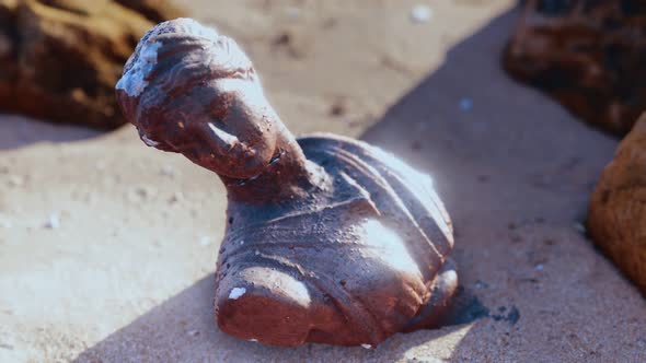 Ancient Woman Bust at Sand Beach