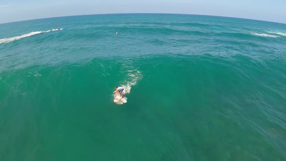 Aerial view of a wipeout sup stand-up paddleboard surfing in Hawaii.