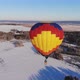 People Fly on a Big Bright Balloon Over the Winter Forest - VideoHive Item for Sale