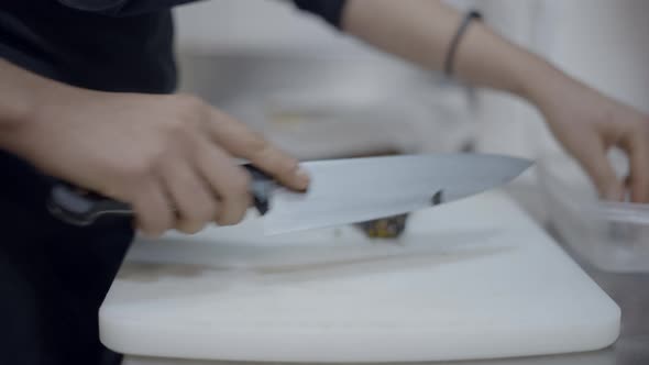 Unrecognizable Chef Cuts Vegetables on Cutting Board Close Side View