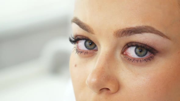 Woman Shifts Her Gaze at the Cosmetology Salon