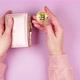 Female hands hold golden bitcoin and wallet on pink background - VideoHive Item for Sale