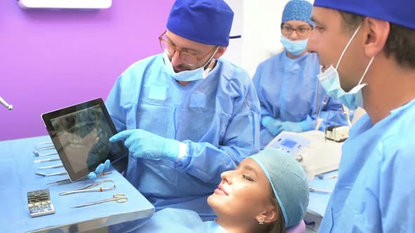 Dental Team Examining Radiography