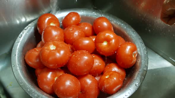 Water Splashes on Red Tomatoes.