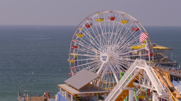 Aerial view of Ferris wheel at Pacific Park overlooking sea