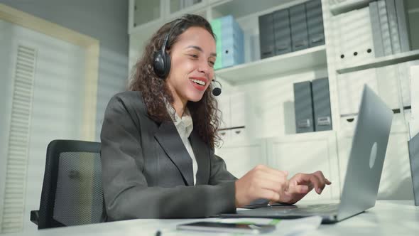 Latino beautiful business woman call center smile while work in office.