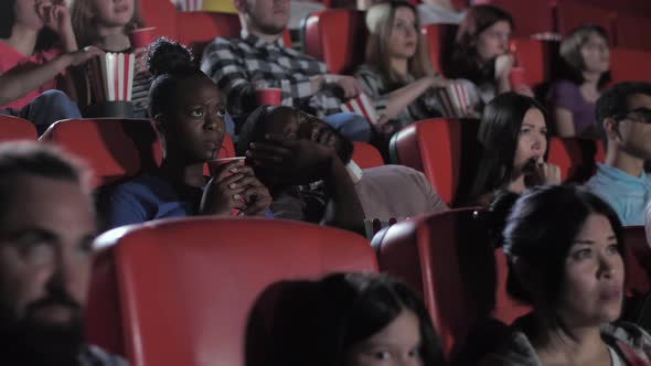 African American Man Sleeping During Horror Movie