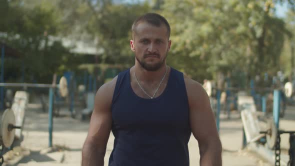 Determined Man Preparing for Strength Training