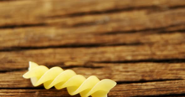 Fusilli on wooden table