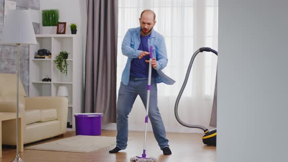Funny Man Cleaning Apartment