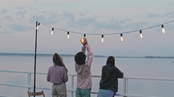 Friends Enjoying Lake View in Morning