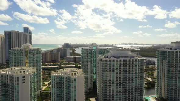 Aerial Pull Out Shot Luxury Buildings Sunny Isles Beach Boulevard 4k Backwards Motion