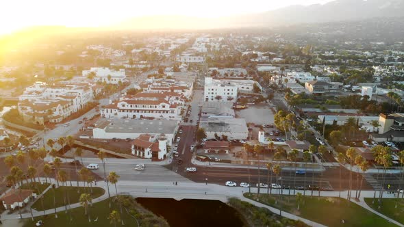 Aerial drone shot over the luxury hotels and expensive homes of downtown State Street during sunset