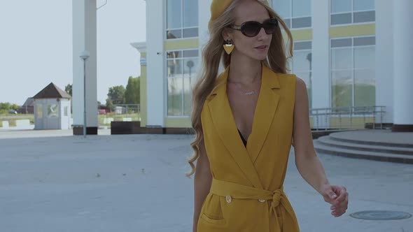 Confident Stylish Woman Walking on Street