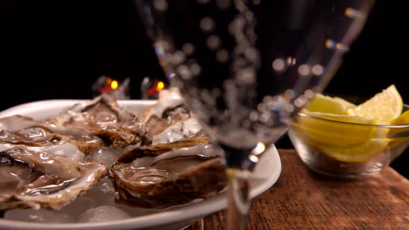 Glass of Champagne with Fresh Oysters on Ice