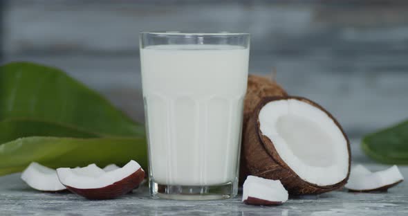 A Glass of Coconut Milk Slowly Rotates. 