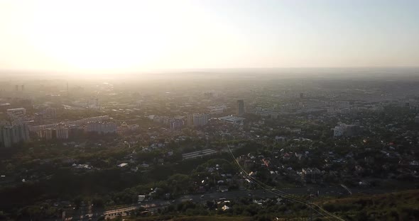 Bright Yellow Sun Over the City of Almaty