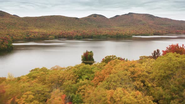 Breathtaking Aerial View of Mountain Lake in Vermont Fall Colors in Peak Season