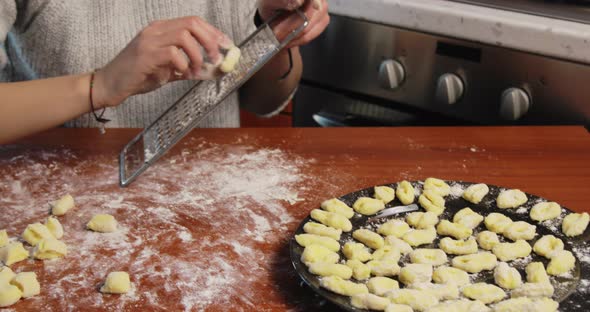 Young Girl is Making Homemade Potato Italian Gnocchi on the Table