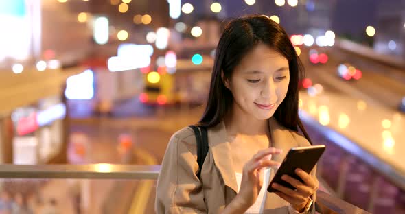 Woman use of smart phone at night