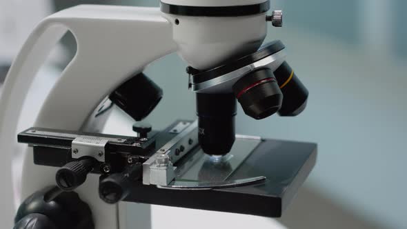 Biochemistry Microscope in Scientific Laboratory at Clinic