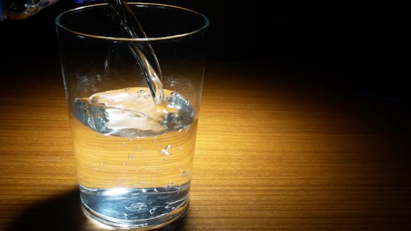 Effervescent Tablet Dropping to Glass of Water