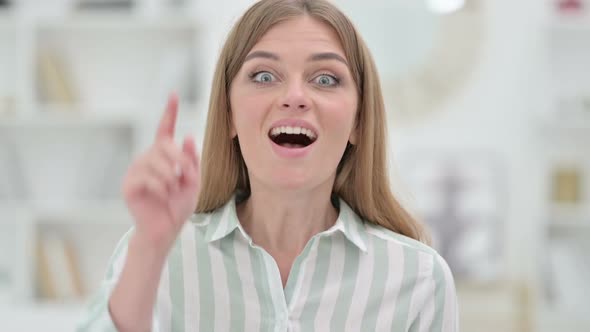 Portrait of Assertive Young Woman with Pointing at the Camera