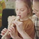 Mom Teaches Her Daughter How to Hold the Flute - VideoHive Item for Sale