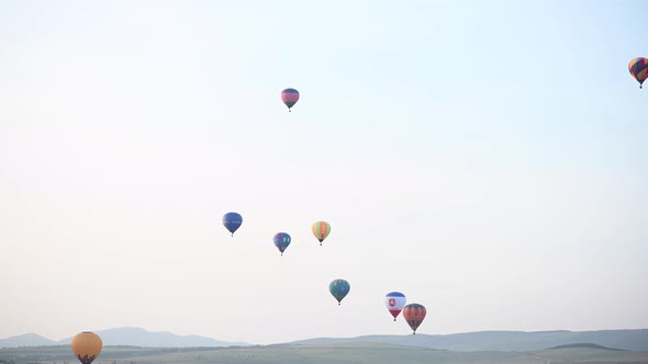 Beautiful Rocky Landscape of Crimea with Colorful Hotair Balloons Balloons Flying on Sunset HDR Time