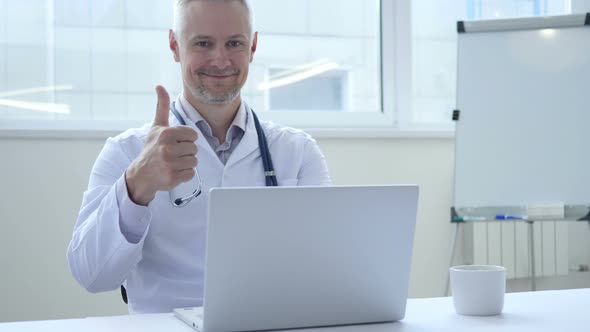 Smiling Positive Doctor At Work Looking at Camera