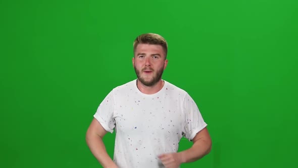 Portrait of Bearded Guy Calmly Is Running Then Stoped on Green Screen Background. Chroma Key. Front