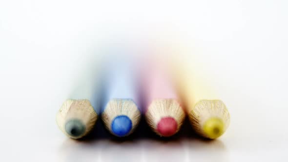 Colored pencils arranged in a row